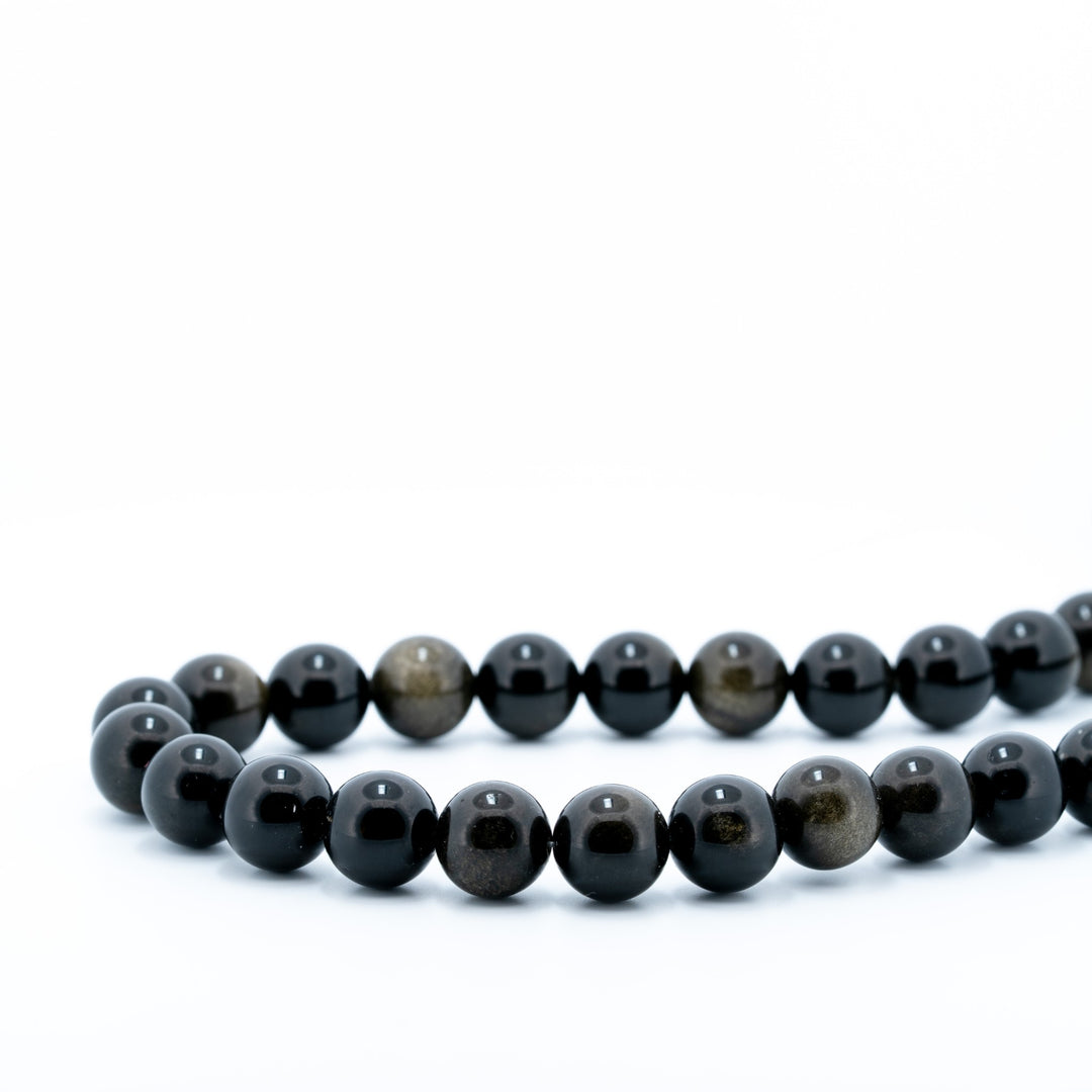 Auksinio obsidiano karoliukų gija 10 mm
